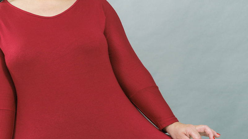 Curvy woman in red tunic top for women