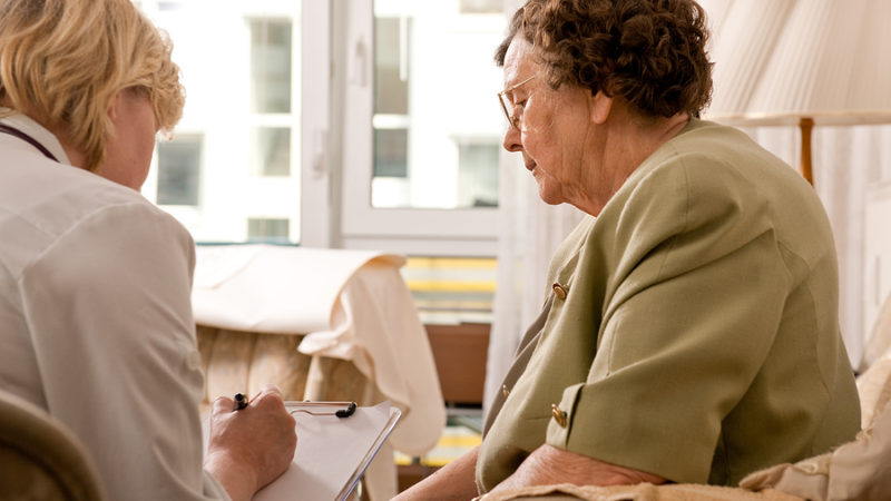 Senior woman inquiring about nursing home costs